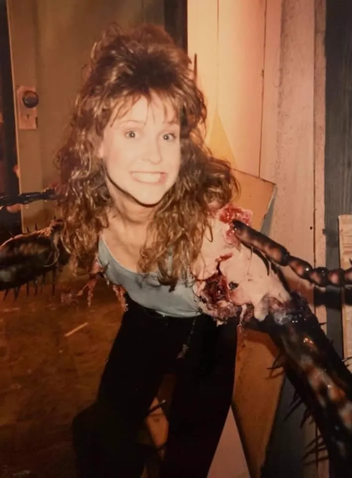 Brooke Theiss wears the cockroach-leg arm appliances for Debbie's transformation scene.